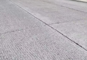 Repairing cracks in road surfaces